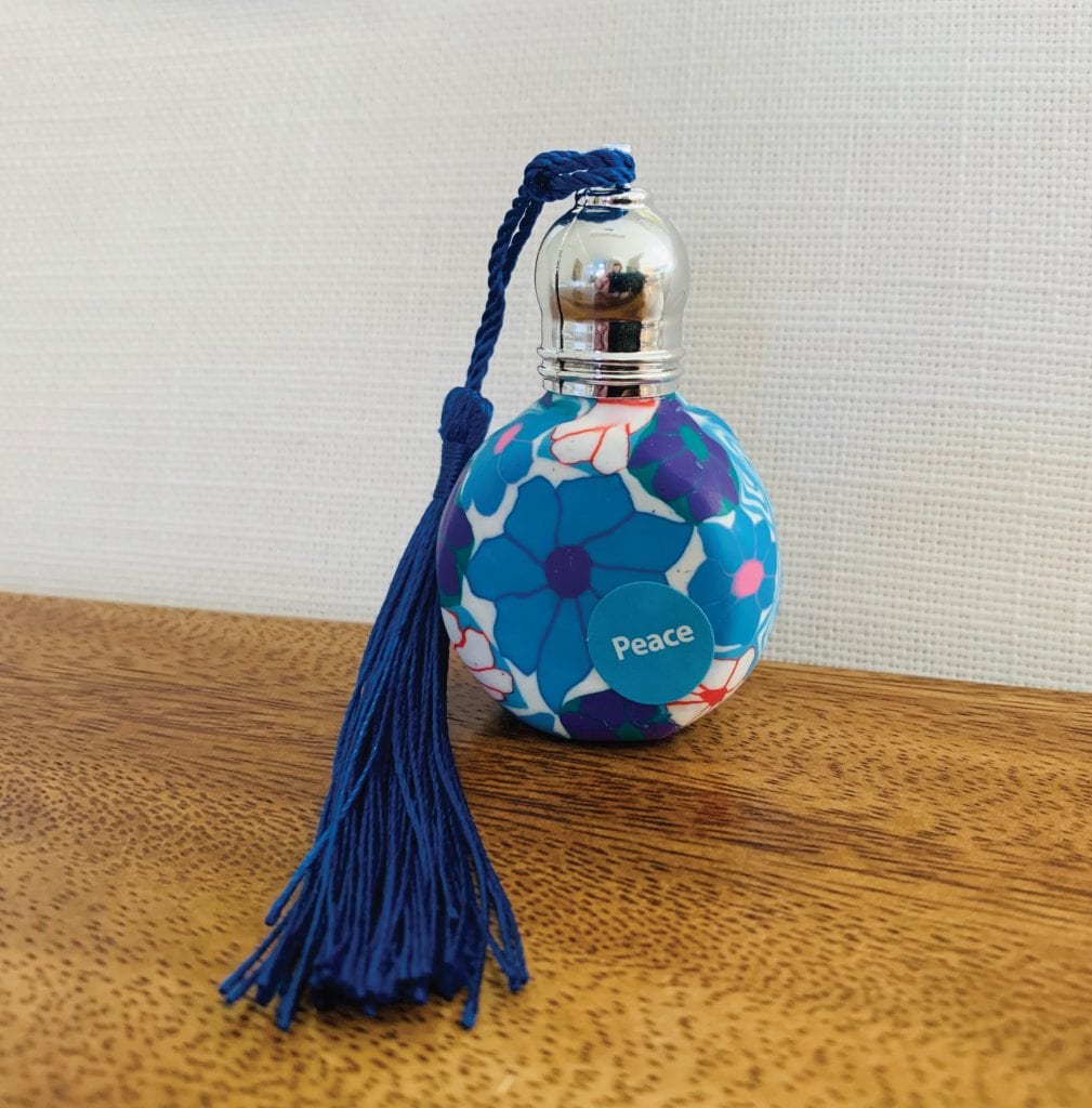 Flowery perfume bottle with roller
